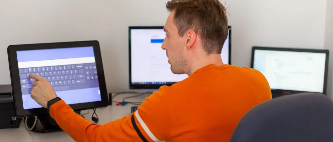 desktop application development developer in front of a monitor