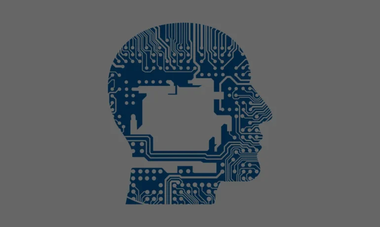 Silhouette of a human head, filled with a blue circuit board pattern, symbolizing technology, software development, on a solid gray background.